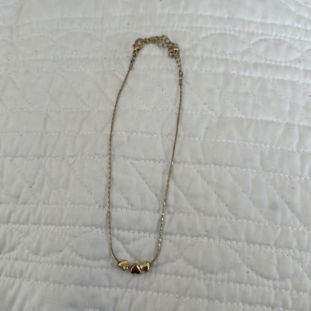 Three hearts golden necklace
